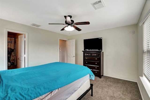 carpeted bedroom with ceiling fan, visible vents, and baseboards