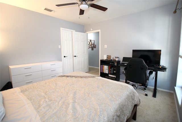 bedroom with visible vents, ceiling fan, light carpet, and baseboards