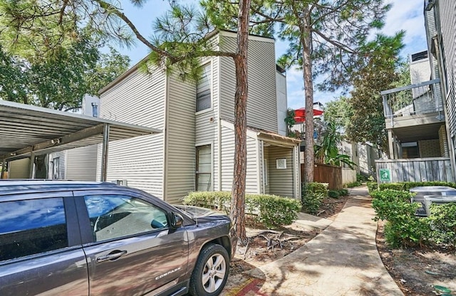 view of side of property with central AC unit