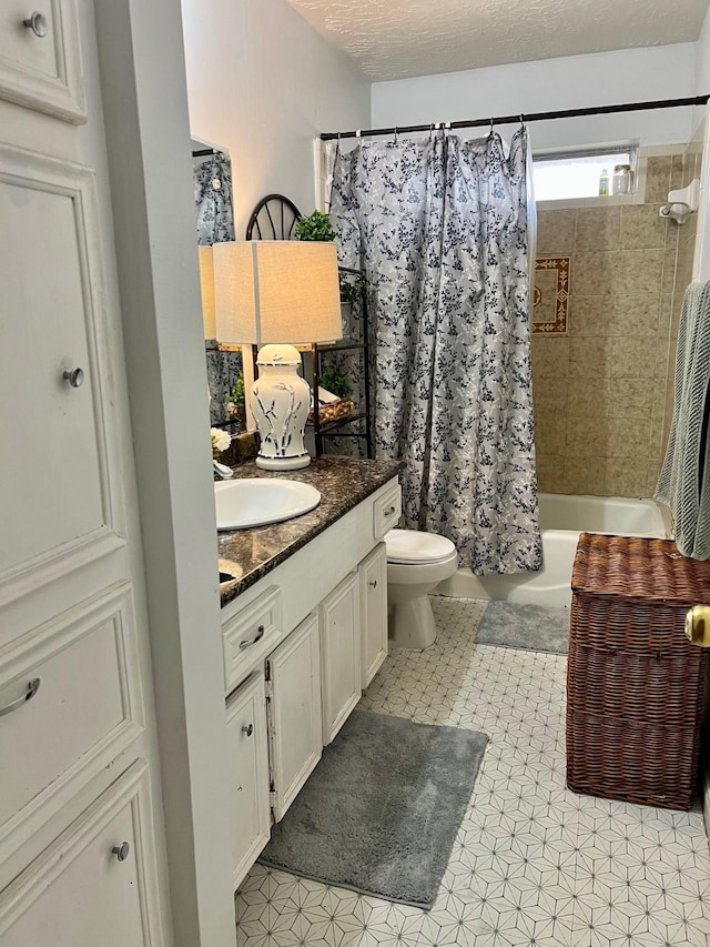 bathroom featuring shower / bathtub combination with curtain, toilet, vanity, and a textured ceiling