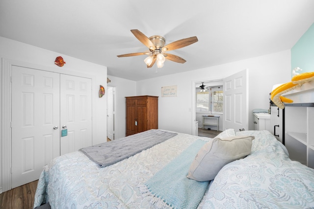 bedroom with ceiling fan, a closet, and wood finished floors