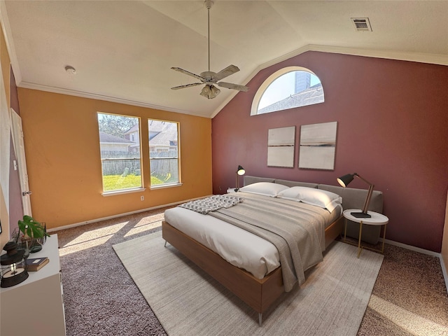 carpeted bedroom with baseboards, visible vents, a ceiling fan, lofted ceiling, and crown molding