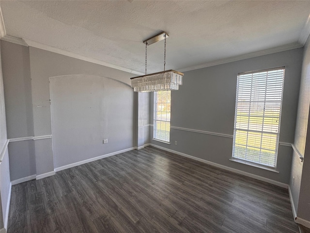 unfurnished room with ornamental molding, dark wood-type flooring, and a wealth of natural light