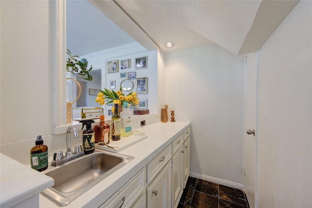 bathroom featuring baseboards and vanity