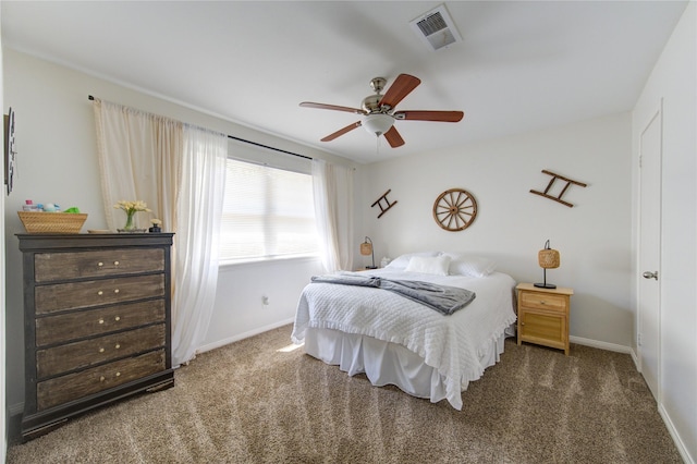 carpeted bedroom with a ceiling fan, visible vents, and baseboards