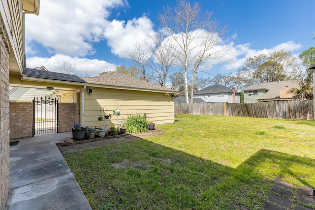 view of yard with a gate and fence