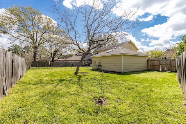 view of yard with a fenced backyard