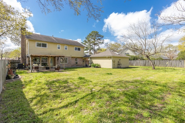 rear view of house with a patio area, a yard, a fenced backyard, and central AC