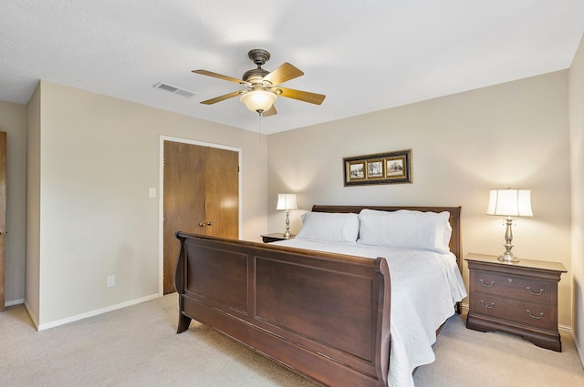 bedroom with light carpet, visible vents, ceiling fan, and baseboards