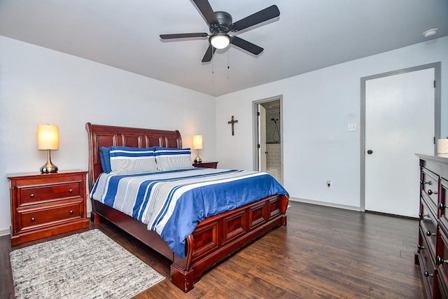 bedroom featuring ceiling fan, baseboards, wood finished floors, and ensuite bathroom