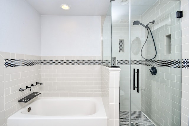 bathroom featuring a stall shower, visible vents, recessed lighting, and a bath