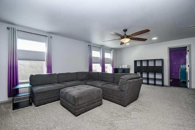 living area featuring carpet, baseboards, a ceiling fan, and recessed lighting