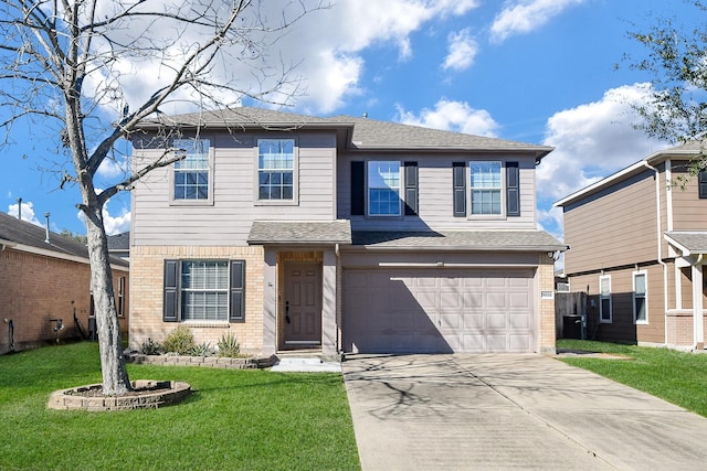 traditional-style house featuring a garage, brick siding, a shingled roof, concrete driveway, and a front yard