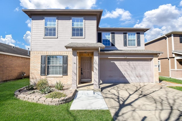 traditional-style home with a garage, driveway, and brick siding