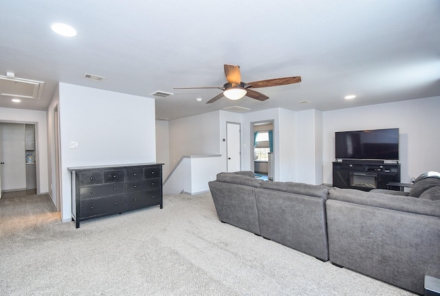 carpeted living area with recessed lighting, visible vents, and ceiling fan