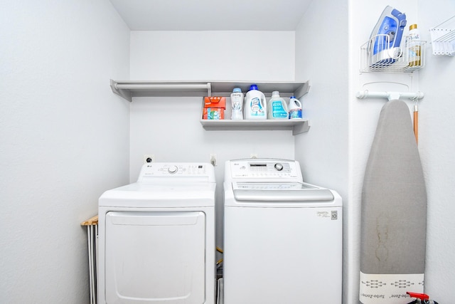 washroom featuring laundry area and independent washer and dryer