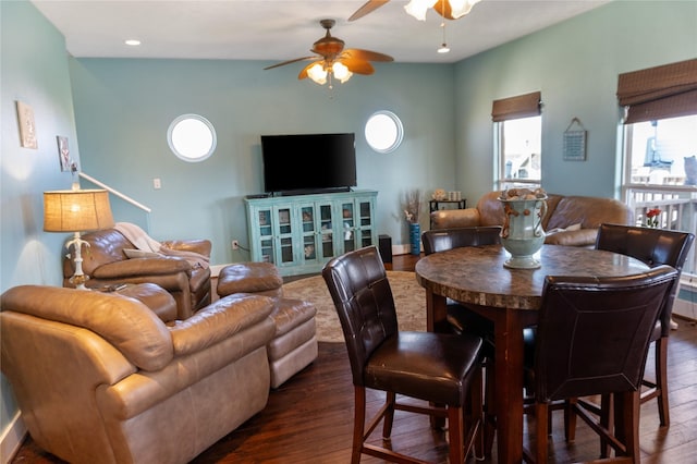 dining area with dark wood finished floors and a ceiling fan