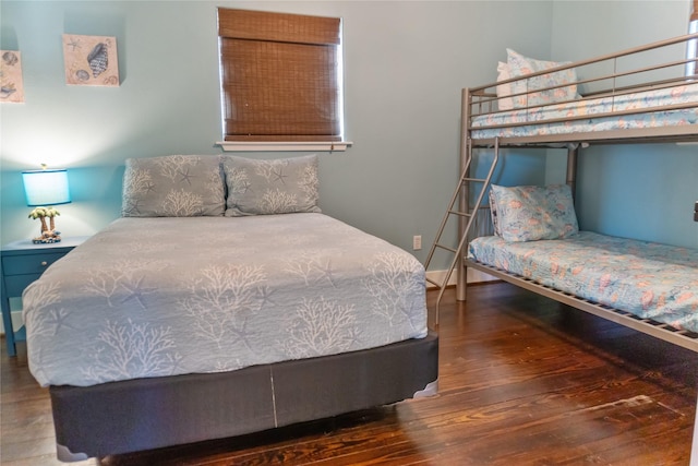 bedroom with wood finished floors