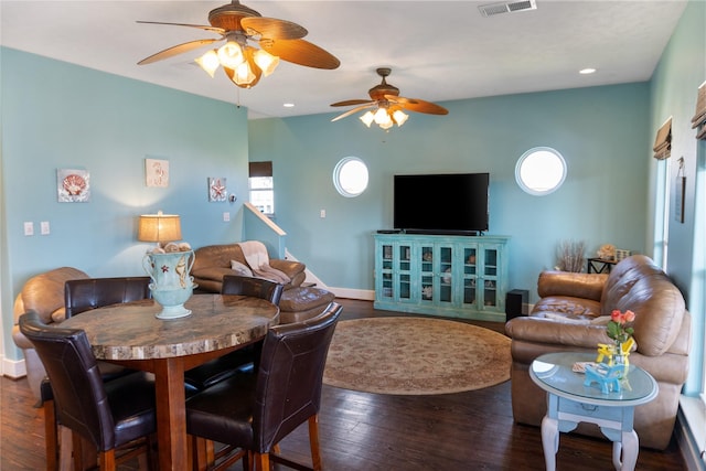 living room with hardwood / wood-style floors, recessed lighting, visible vents, and baseboards