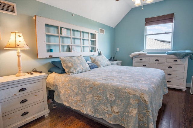 bedroom featuring lofted ceiling, dark wood finished floors, and visible vents