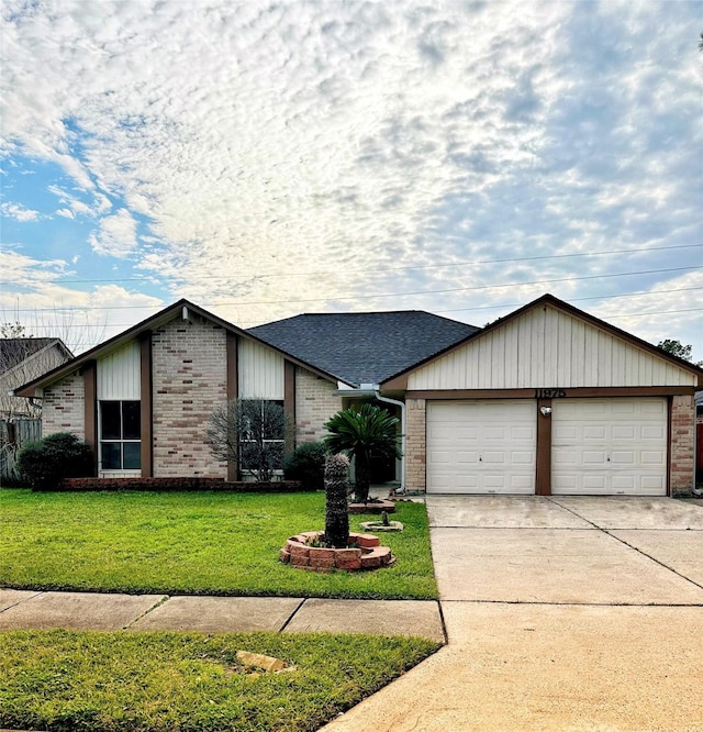 view of front of property with an attached garage, brick siding, a shingled roof, concrete driveway, and a front yard