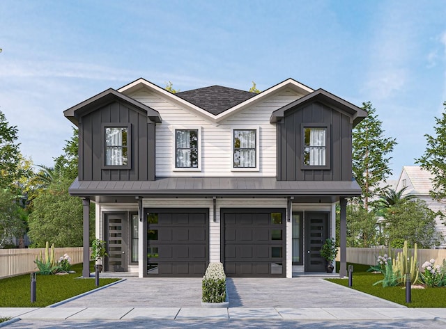 view of front of home with an attached garage, fence, and board and batten siding