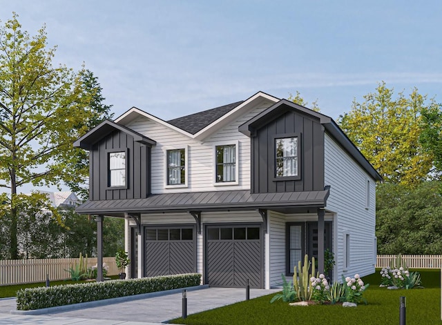 view of front of property with board and batten siding, a standing seam roof, fence, and a garage