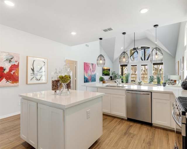 kitchen featuring a sink, stainless steel appliances, visible vents, and light wood finished floors