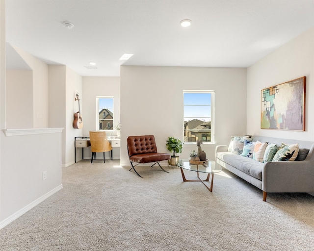 carpeted living room featuring recessed lighting and baseboards