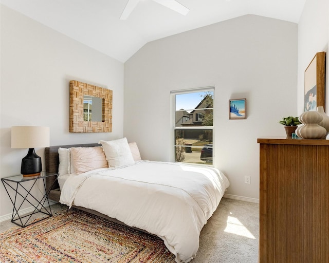 bedroom with baseboards, a ceiling fan, carpet flooring, and vaulted ceiling