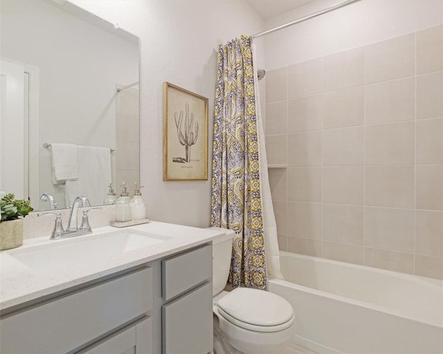 bathroom featuring vanity, shower / tub combo, and toilet