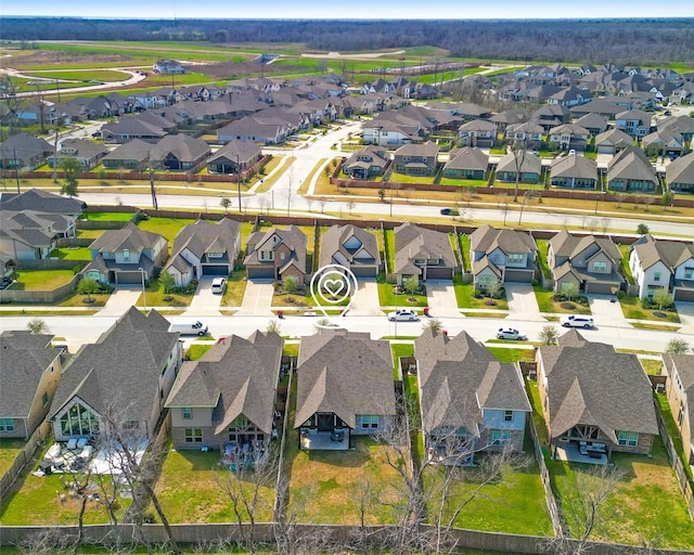 birds eye view of property with a residential view