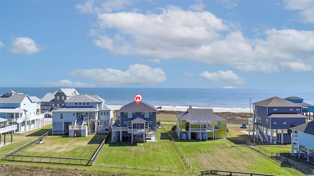 property view of water featuring a residential view, a beach view, and fence