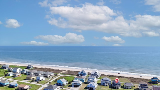 aerial view featuring a water view, a residential view, and a view of the beach