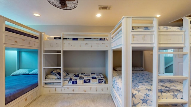 carpeted bedroom with visible vents and recessed lighting