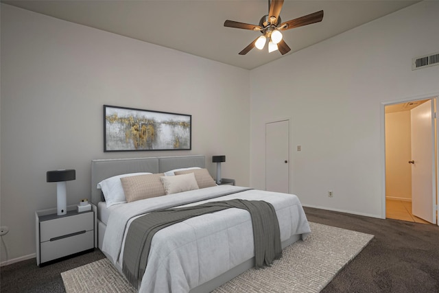 bedroom with ceiling fan, carpet flooring, visible vents, and baseboards