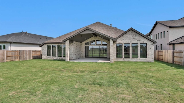 24618 Celestial Lily Dr, Katy, TX 77493 - back of property with a yard, brick siding, a patio, and a fenced backyard