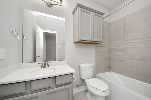 full bathroom with baseboards, shower / tub combination, vanity, and toilet