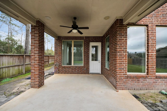 view of patio / terrace featuring fence and a ceiling fan