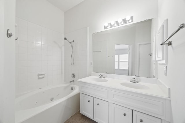 bathroom with double vanity, tile patterned flooring, washtub / shower combination, and a sink