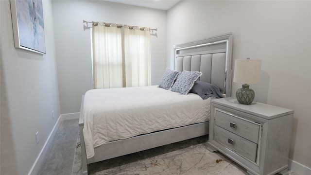 bedroom featuring baseboards