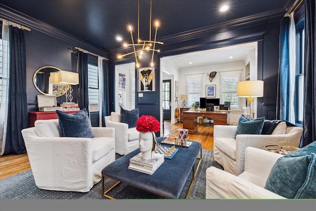 living area with ornamental molding, recessed lighting, a chandelier, and wood finished floors