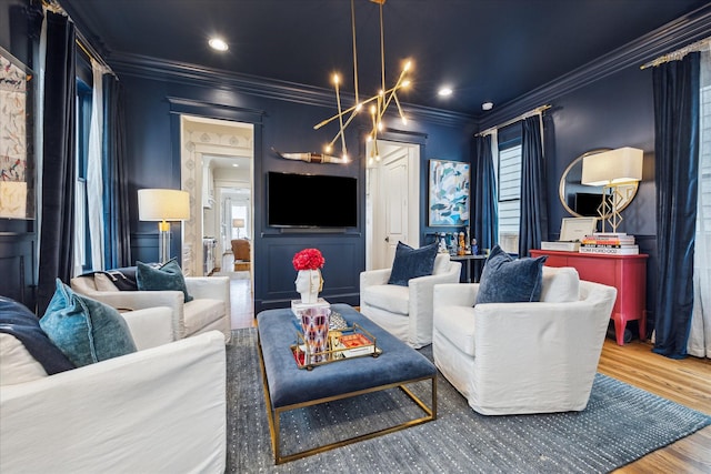 living room featuring ornamental molding and wood finished floors