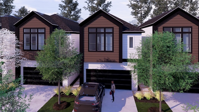 view of front of home with driveway, a shingled roof, and a garage