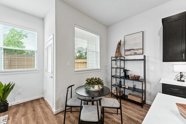 2110 Dewalt St Unit H, Houston, TX 77088 - dining area featuring light wood-style floors and baseboards