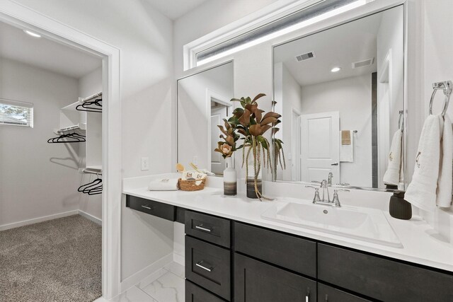 2110 Dewalt St Unit H, Houston, TX 77088 - bathroom featuring vanity, baseboards, and marble finish flooring
