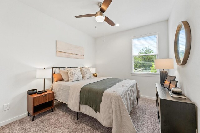 2110 Dewalt St Unit H, Houston, TX 77088 - carpeted bedroom featuring baseboards and ceiling fan