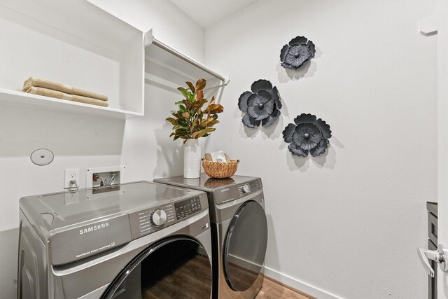 2110 Dewalt St Unit H, Houston, TX 77088 - laundry area featuring separate washer and dryer, wood finished floors, and baseboards