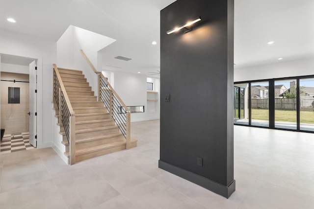 stairway featuring visible vents and recessed lighting