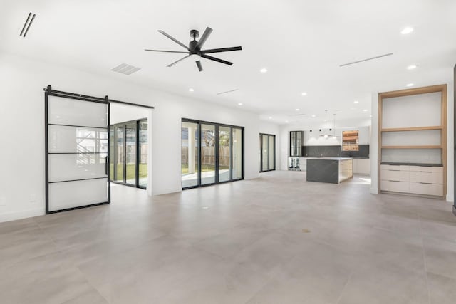 unfurnished living room featuring ceiling fan, concrete floors, visible vents, and recessed lighting